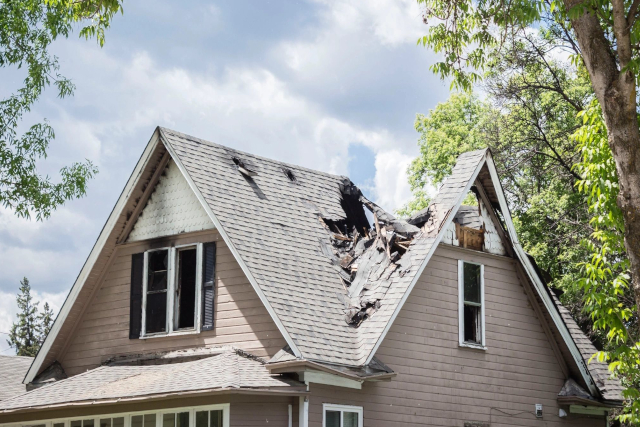 home with broken roof